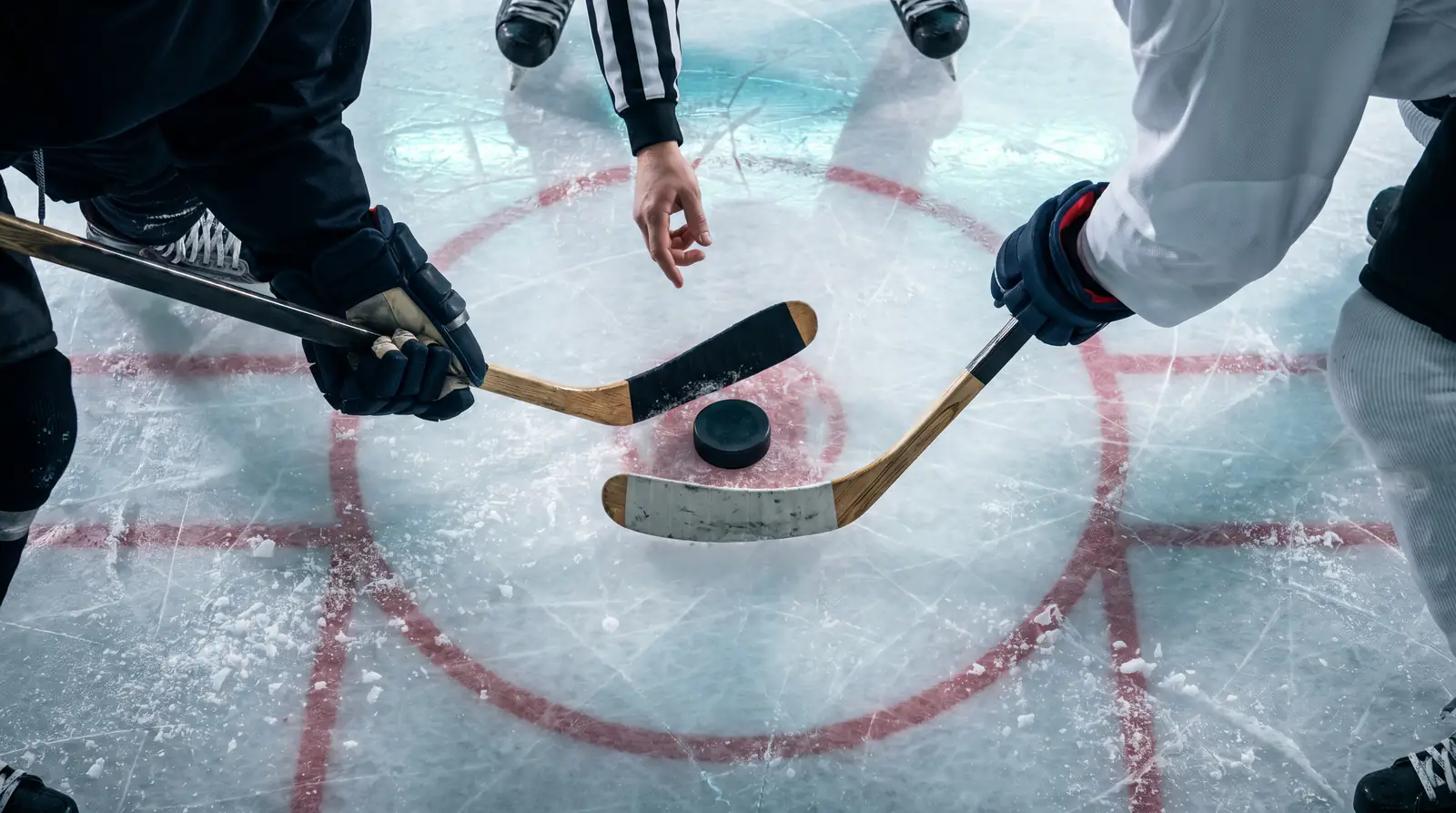 NHL face-off in a circle marking the start of a fresh period for period-market betting