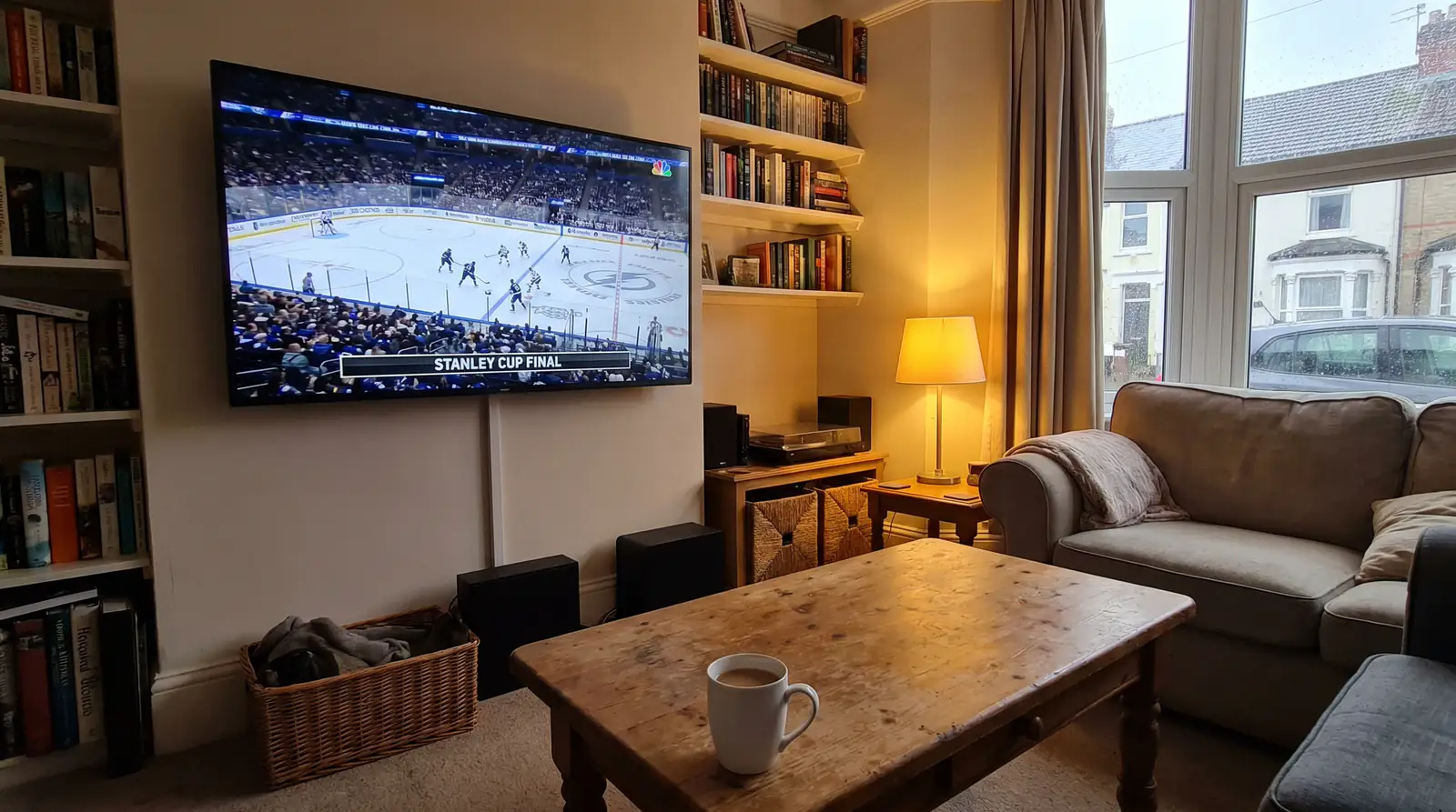 UK living room view of a Stanley Cup final with anonymous teams on a TV screen